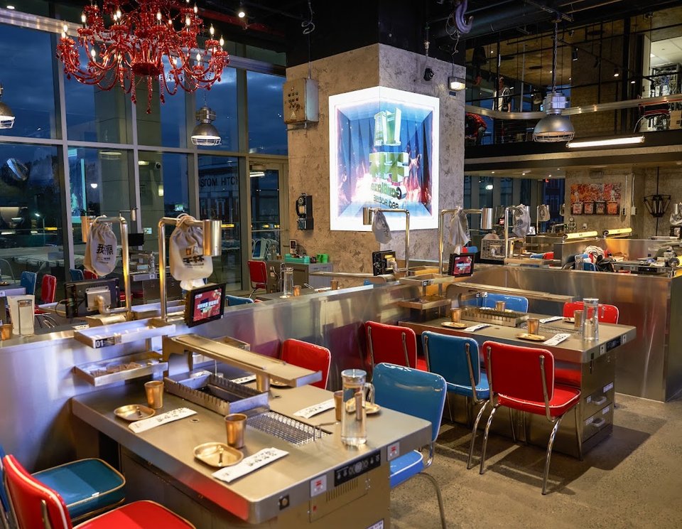 BBQ restaurant with grilled skewers and drinks.